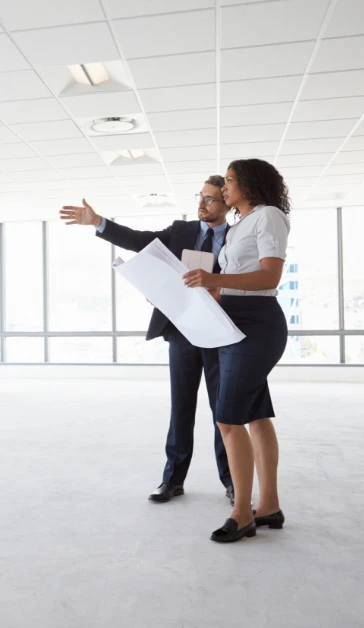 Man and a woman looking at a chart together 